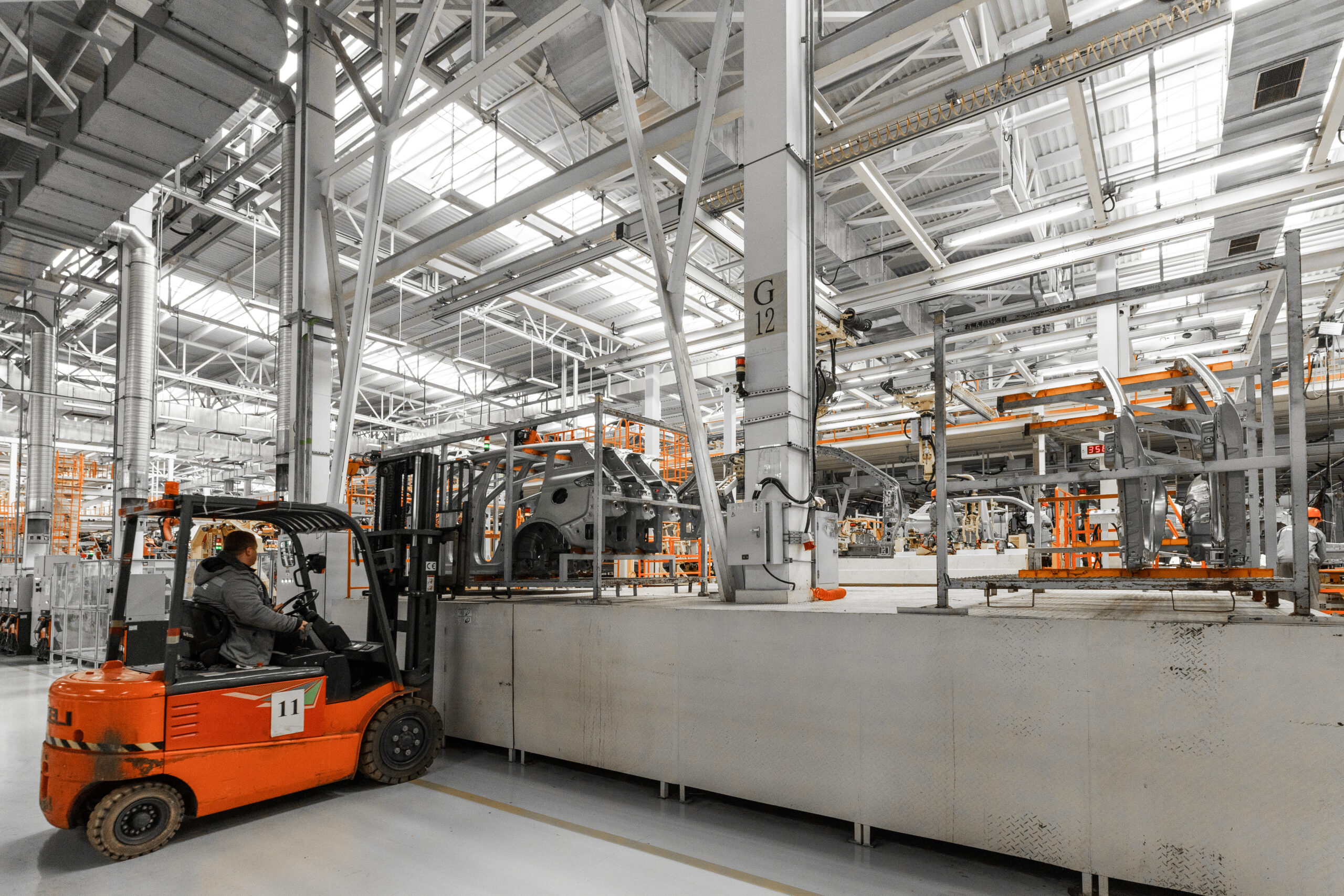 electric forklift battery charger supplying stable power for material handling fleet in manufacturing plant